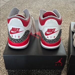 Nike Red and White Sneakers with Iconic Design